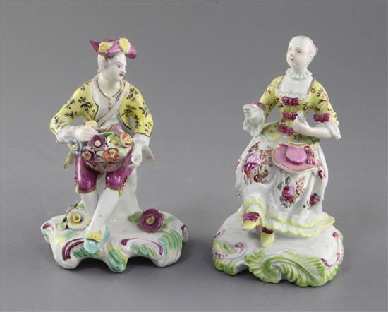 A near pair of early Derby Pale Family figures of a seated gentleman and woman, c. 1756-8, h. 13cm, slight restoration